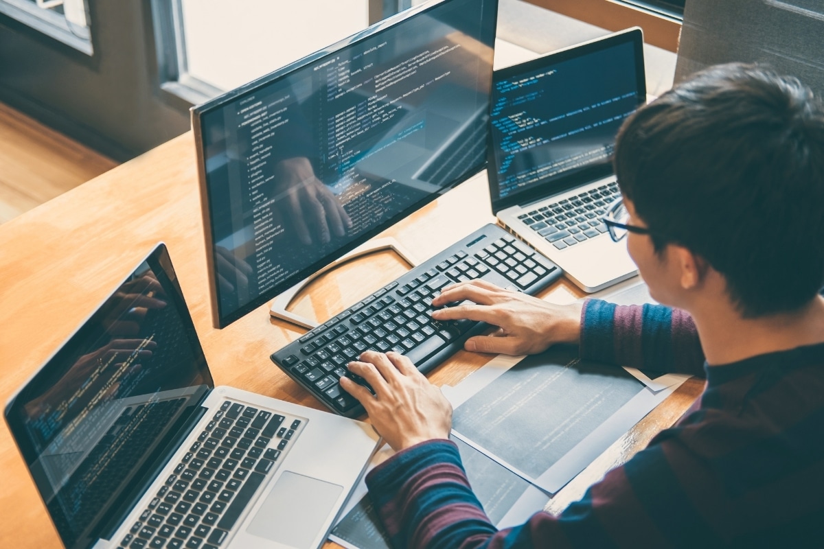 Developer writing code for custom software and business automation projects